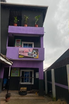 School building exterior with plants